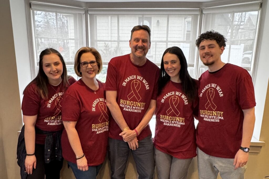 Gary Brown and his family pose wearing matching multiple myeloma awareness shirts 