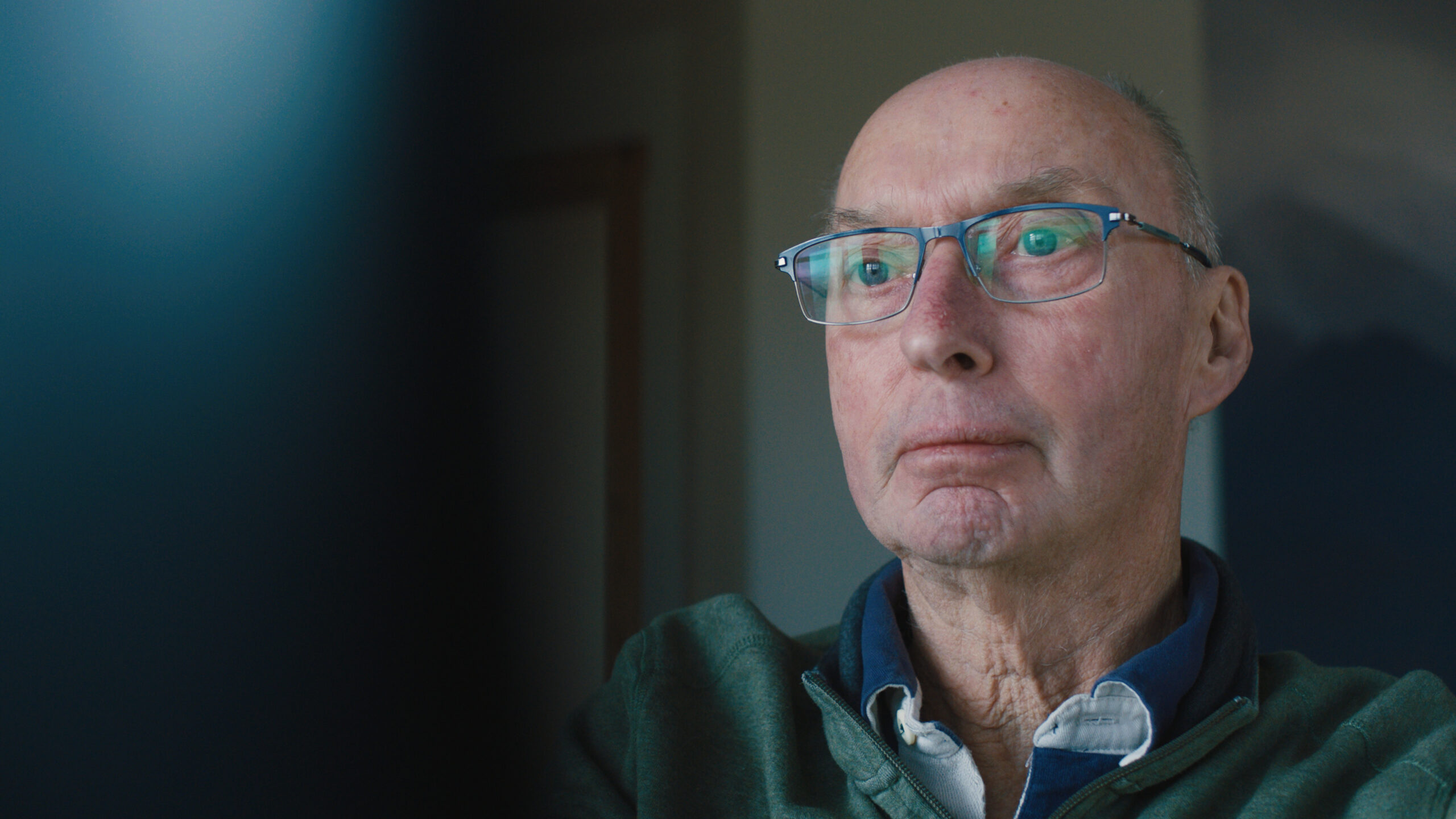 Myeloma patient Geoff looks off to his lef